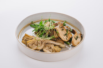 Vegetarian dish of boiled vegetables, zuccini and greens