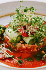 Tartare dish of vegetables red pepper, cucmber and tomato sauce