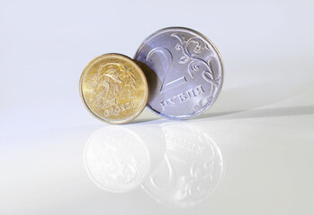 Russian rubles and polish zloty on white background with reflections. Russia and Poland confrontaton - obrazy, fototapety, plakaty