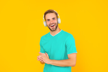 online education. back to school. young guy in headphones. music lover.