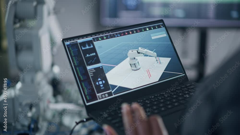 Poster Black Female Developer Typing at Laptop Keyboard while Programming Robotic Arm At Factory. Bionic Claw is Moving Under her Control. New Era in Automatic Manufacturing Industry Concept. Close Up View