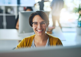 Im passionate about business. Portrait of a smiling young businesswoman working in a modern office.