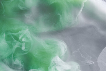 Green smoke on white ink background, colorful fog, abstract swirling emerald ocean sea, acrylic...