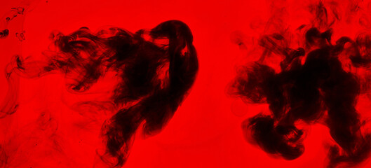 Obraz premium Black and red ink background, colorful fog, abstract swirling ocean, acrylic paint pigment underwater, dark smoke