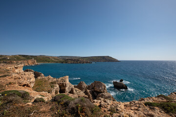 Naklejka na ściany i meble Rocky coastline of Malta landscape with sea view