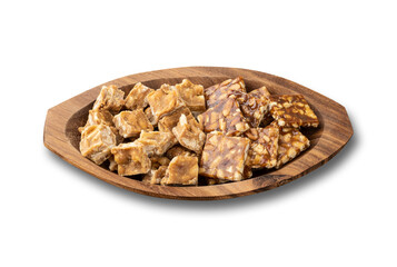Pe de moleque, typical brazilian peanut candy isolated over white background. June festival food