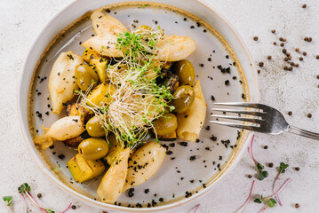 Dietary dish of squids, olives and greens