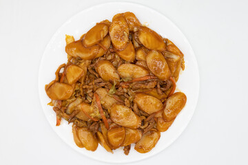 Shanghainese Rice Cakes with Pork on a White Plate