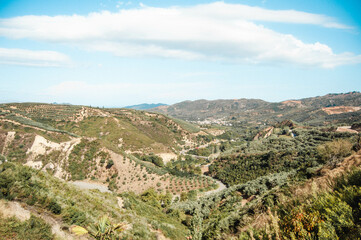 Fototapeta na wymiar Landscape with roads among green hills, Crete.
