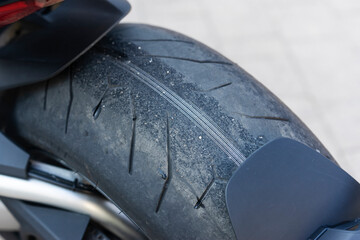 A bald tire of the motorbike