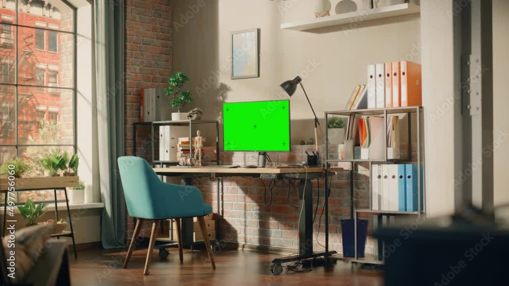 Poster desktop computer monitor standing on height adjustable desk with a green screen chromakey mock up di
