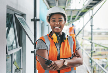 Youll want to invest in this new development. Portrait of a young woman working at a construction site. - obrazy, fototapety, plakaty