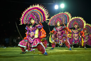 BAMNIA, PURULIA, WEST BENGAL , INDIA - DECEMBER 23RD 2015 : Four dancers performing at Chhau Dance festival. It is a very popular Indian tribal martial dance performed at night amongst spectators.