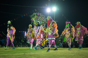 BAMNIA, PURULIA, WEST BENGAL , INDIA - DECEMBER 23RD 2015 : Group of dancers performing at Chhau Dance festival. It is a very popular Indian tribal martial dance performed at night amongst spectators. - obrazy, fototapety, plakaty