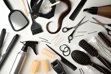 Set of tools for hair cutting and styling on table