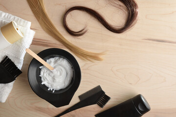 Hair care and coloring products on wooden table top view
