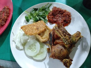 chicken with vegetable salad in white plate
