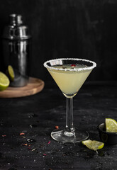 Lime cocktail over black background
