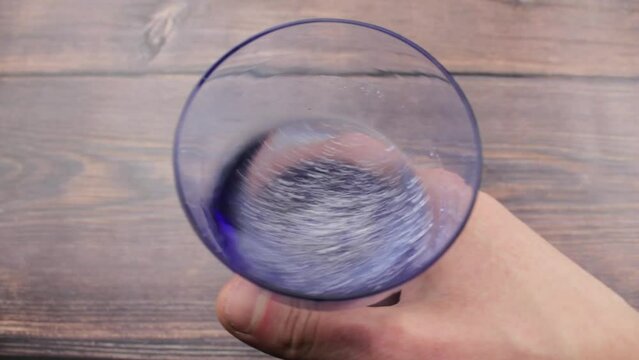 White powder solubility in water. Powder in a glass.