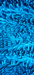 Close up of noodle textured blue microfiber mop carpet.