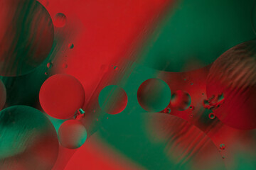 Abstract shot of red and green round oil drops close-up. Abstract background