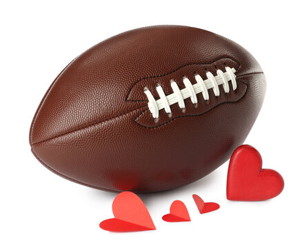 American football ball and hearts on white background