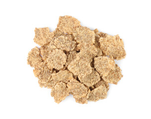 Pile of bran flakes on white background, top view. Healthy breakfast cereal
