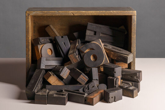 vintage wooden letterpress printing blocks, letters and numbers in a wooden box
