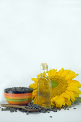 bottle of oil with sunflower seeds