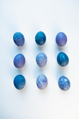 Space colored eggs on white background.