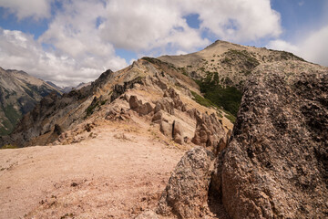Hiking in Patagonia. View of the path along Bella vista hill mountaintop. Beautiful rocky formation.