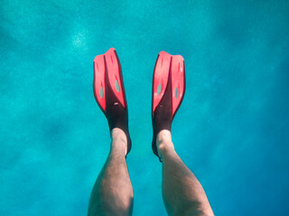 view of men legs in flippers under water © phpetrunina14