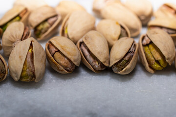 Group of Pistachio Nuts on Marble 