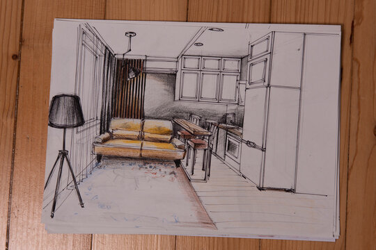 The photo shows sketches, a design project drawn with pencils on a piece of paper. Drawings, sketches, pencils, stationery on the table.