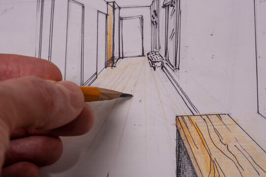 The photo shows sketches, a design project drawn with pencils on a piece of paper. Drawings, sketches, pencils, stationery on the table.