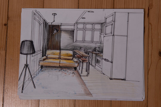 The photo shows sketches, a design project drawn with pencils on a piece of paper. Drawings, sketches, pencils, stationery on the table.