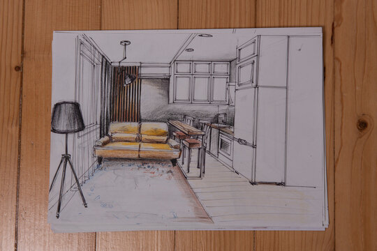 The photo shows sketches, a design project drawn with pencils on a piece of paper. Drawings, sketches, pencils, stationery on the table.