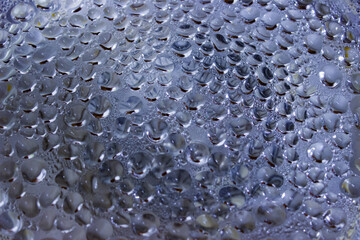 Bright blue background, crystal clear water drops (raindrops). Abstract natural pattern, wallpaper, concept art. Glittering paint texture. Graphic resources, design, 3D, decoration, macro photography