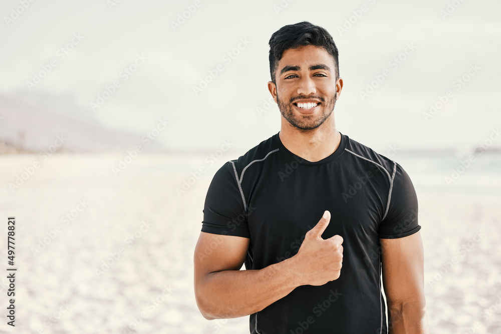 Poster I changed my lifestyle and it changed my life. Shot of a sporty young man showing thumbs up while out for a workout.