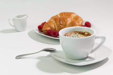 Fresh coffee in white cup, breakfast concept
