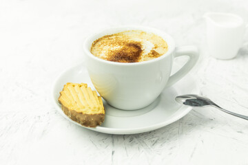 Fresh coffee in white cup, breakfast concept