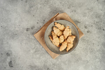 Russian slavic traditional pastry called roguelikes. Cakes bagels. Crispy croissants. Food on grey background, Copy space