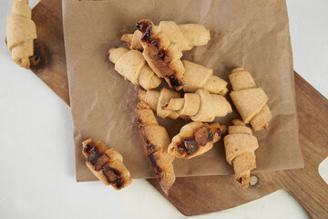 Russian slavic traditional pastry called roguelikes. Cakes bagels. Crispy croissants. Food on white background, Copy space