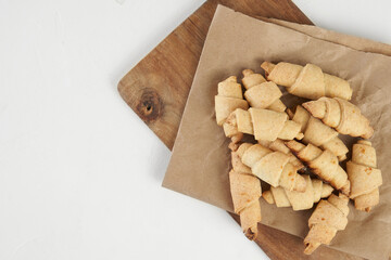 Russian slavic traditional pastry called roguelikes. Cakes bagels. Crispy croissants. Food on white background, Copy space