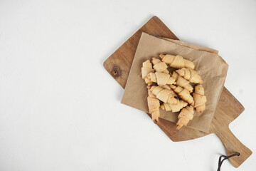 Russian slavic traditional pastry called roguelikes. Cakes bagels. Crispy croissants. Food on white background, Copy space