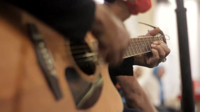 Someone plays acoustic guitar great, good player intrument 