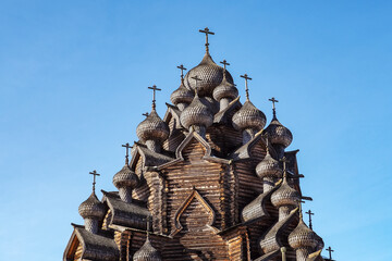 wooden domes on the Orthodox cathedral made in the style of Russian wooden architecture