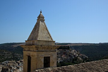 Fototapeta na wymiar Italy, Sicily: Detail of a bell tower overlooking Ragusa.