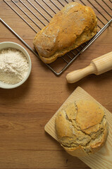 loaf of sourdough bread, home made freshly baked, baking tray, natural ingredients, freshness, flour, trendy, top photo
