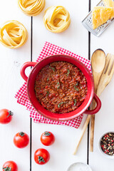 Bolognese sauce on a wooden background. Italian cuisine.